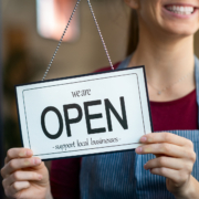Open sign in a small business shop Supporting local is what keeps our community alive!